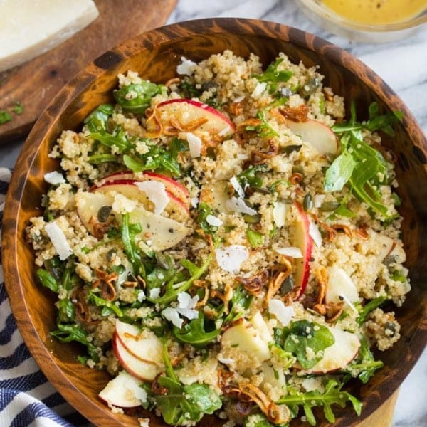 Honey Mustard Quinoa Apple Salad with Crispy Shallots mixed in a wooden bowl
